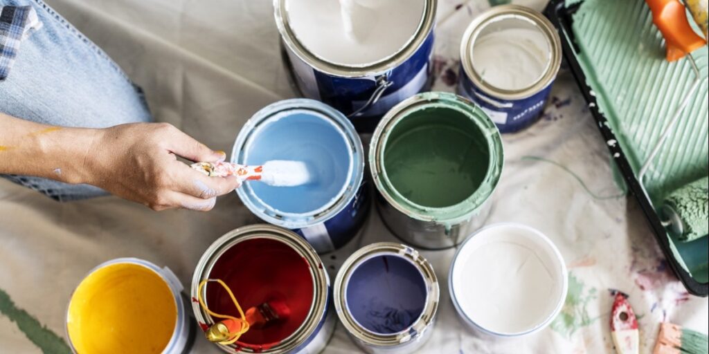 A variety of paint buckets and colors