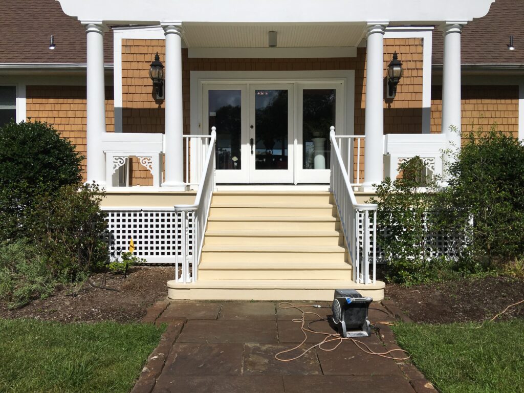 A house entrance with front porch stairs