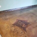 CCV-logo-on-stained-concrete-2-5e29cd5eed918-1140x855