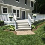 Freshly painted rear deck and rails with white paint