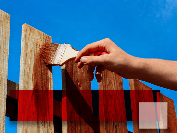 Staining a wooden fence