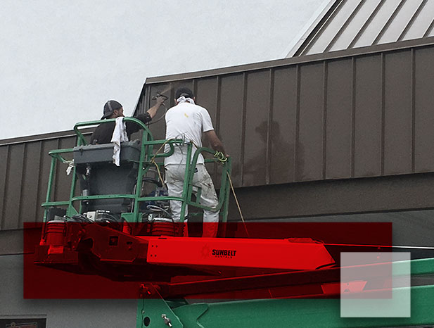 Men painting building exterior