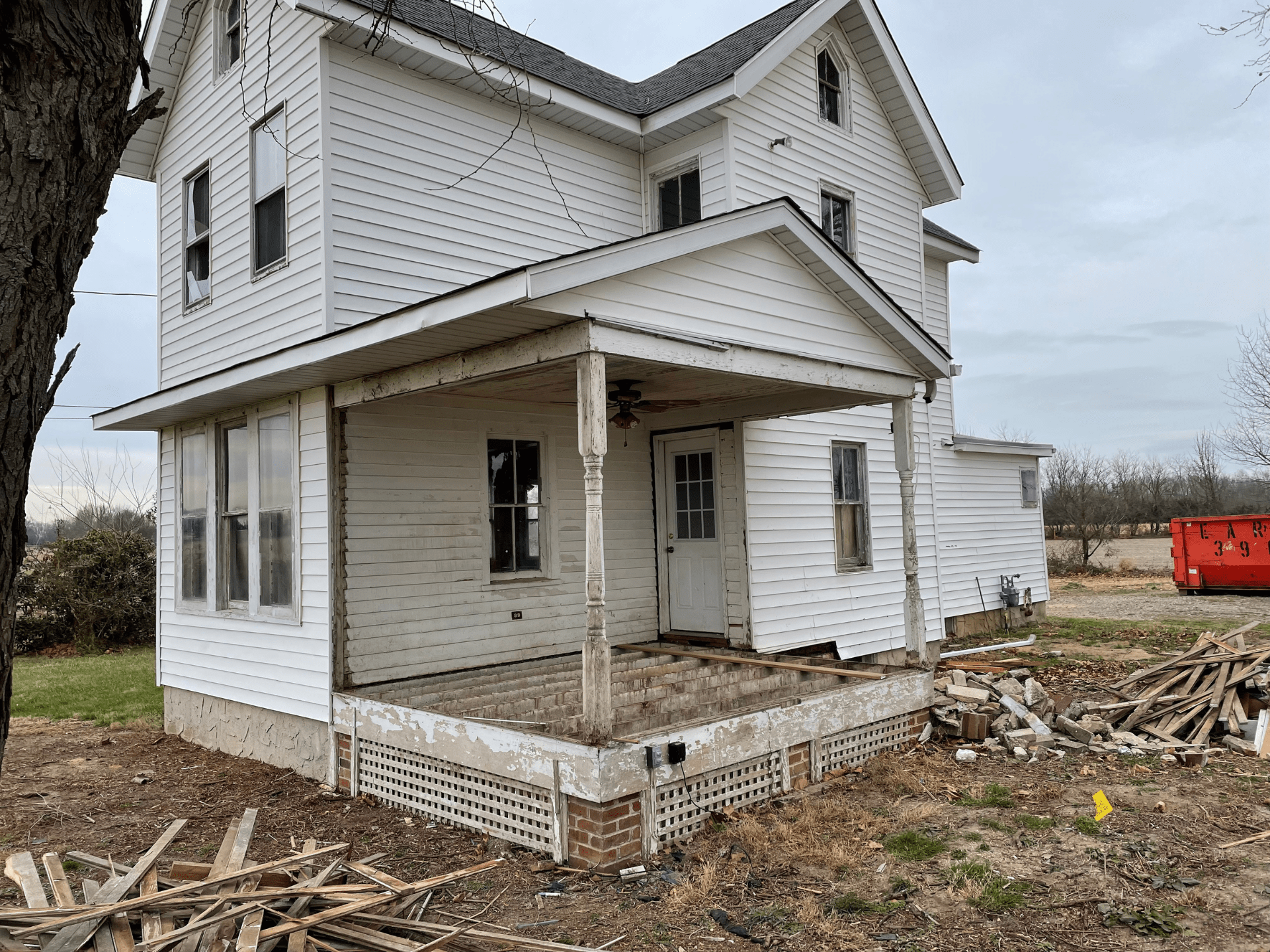 Pre renovation image of exterior farmhouse