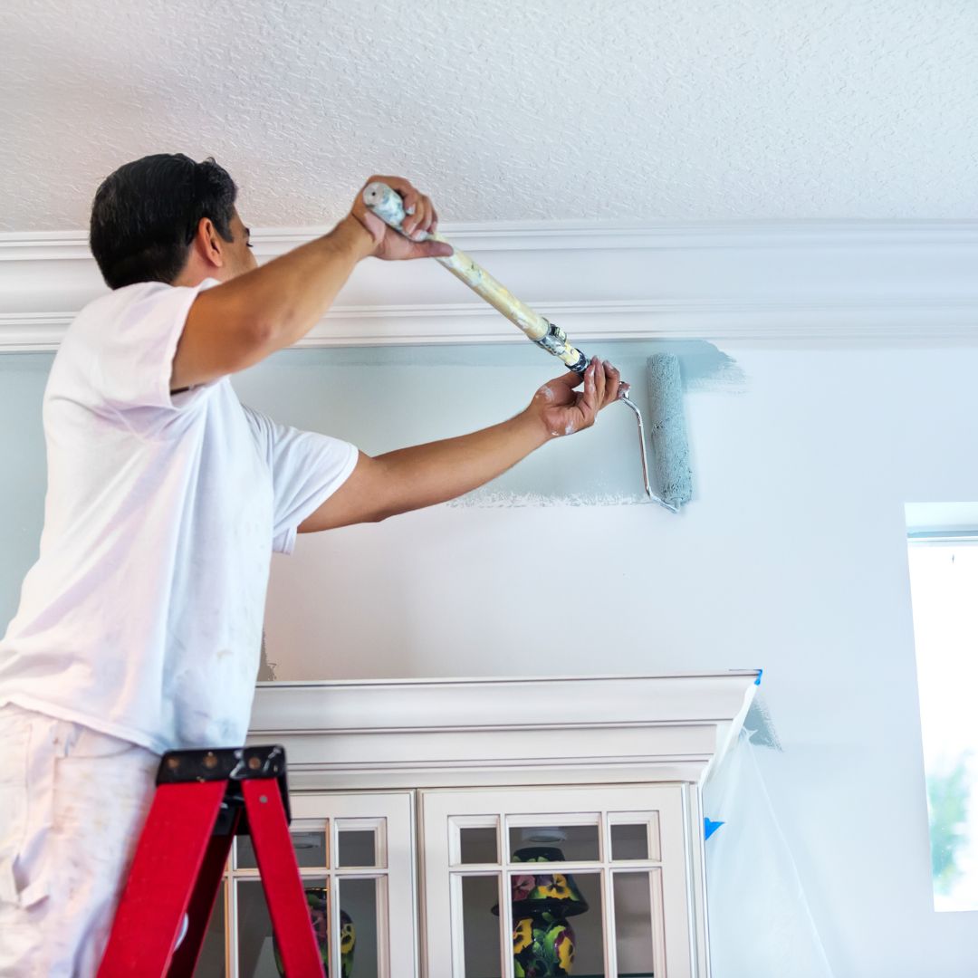 painting above a window inside a home