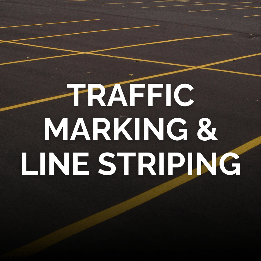 Yellow lines painted on a black asphalt with the words Traffic Marking and Line Striping across the middle