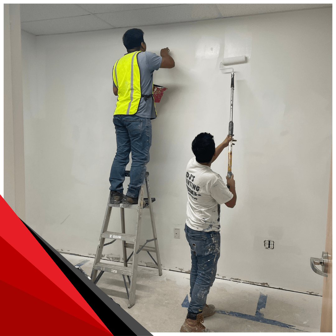 2 painters painting white wall 2 expert painters working together to paint a interior office wall