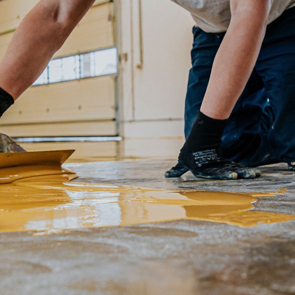 Applying urethane cement by hand trowel